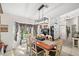 Bright dining area featuring tile flooring, a pendant light, and backyard views at 338 7Th N Ave, Tierra Verde, FL 33715