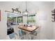Dining room features natural light from the sliding glass doors with outdoor views at 338 7Th N Ave, Tierra Verde, FL 33715