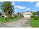 Beautiful home with well-maintained front yard, lush landscaping, and inviting curb appeal at 338 7Th N Ave, Tierra Verde, FL 33715