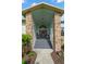 Inviting front porch with double doors, decorated with wreaths, and rocking chairs at 338 7Th N Ave, Tierra Verde, FL 33715