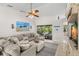 Comfortable living room featuring tile floors and a sectional sofa with views to lanai at 338 7Th N Ave, Tierra Verde, FL 33715