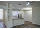 Open kitchen with stainless steel appliances, bright cabinets, and hardwood flooring at 3405 Silver Glen Ct, Plant City, FL 33566