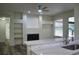 Inviting living area with built-in shelving, modern fireplace, and view to screened lanai at 3405 Silver Glen Ct, Plant City, FL 33566