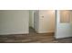 Spacious living room showcasing hardwood floors and fresh, neutral paint at 3405 Silver Glen Ct, Plant City, FL 33566