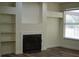 Living room with fireplace, built-ins, and ample lighting at 3405 Silver Glen Ct, Plant City, FL 33566