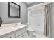 Updated bathroom featuring modern vanity, white tile, and contemporary finishes at 3408 W Swann Ave, Tampa, FL 33609