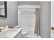 Bathroom showcasing clean white finishes, modern fixtures, and a shower-tub combination at 3408 W Swann Ave, Tampa, FL 33609