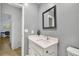 Stylish bathroom with a modern vanity, framed mirror, and a neutral color scheme at 3408 W Swann Ave, Tampa, FL 33609