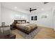 Well-lit bedroom with a comfortable king-size bed, plush bedding, and a stylish area rug at 3408 W Swann Ave, Tampa, FL 33609