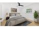 Comfortable bedroom with a cozy king-size bed, modern decor, and a view of the outdoors at 3408 W Swann Ave, Tampa, FL 33609