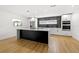 Bright, modern kitchen with stainless steel appliances and a center island at 3408 W Swann Ave, Tampa, FL 33609