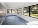 Bright sunroom with large windows overlooking the backyard and unique flooring at 3408 W Swann Ave, Tampa, FL 33609
