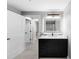 Bright bathroom with a vanity, illuminated mirror, and a view into another room at 345 Bayshore Blvd # 508, Tampa, FL 33606
