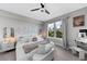 Comfortable bedroom with a modern fan, neon wall art, and city views at 345 Bayshore Blvd # 508, Tampa, FL 33606