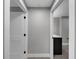 Hallway view with white doors, trim, and a glimpse of a kitchen island at 345 Bayshore Blvd # 508, Tampa, FL 33606