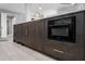 Close-up of the dark cabinets, built-in microwave and gold faucet of the modern kitchen island at 345 Bayshore Blvd # 508, Tampa, FL 33606