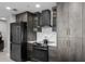 Stylish kitchen with granite countertops, modern appliances and grey cabinets with gold handles at 345 Bayshore Blvd # 508, Tampa, FL 33606