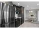 Bright kitchen with modern appliances, dark cabinets and breakfast nook with round table and 4 chairs at 345 Bayshore Blvd # 508, Tampa, FL 33606