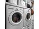 Modern laundry room with new washer and dryer, and built-in storage at 345 Bayshore Blvd # 508, Tampa, FL 33606