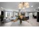 Inviting open-concept living room with a modern chandelier, kitchen view, and sun-filled windows at 345 Bayshore Blvd # 508, Tampa, FL 33606