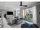 Bright living room with a modern ceiling fan and a sliding glass door to the balcony at 345 Bayshore Blvd # 508, Tampa, FL 33606