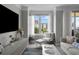 Bright and airy living room with large windows, city views, and chic contemporary furnishings at 345 Bayshore Blvd # 508, Tampa, FL 33606