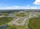 Wide aerial view of a Primary planned community with multiple cul-de-sacs and ponds at 34797 Rainville Loop, Zephyrhills, FL 33541