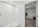 Modern bathroom featuring a white-tiled shower with glass door at 34797 Rainville Loop, Zephyrhills, FL 33541
