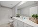 Bright bathroom featuring tub, vanity, and decorative accents at 34797 Rainville Loop, Zephyrhills, FL 33541