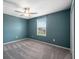 Comfortable bedroom featuring a window and closet at 34797 Rainville Loop, Zephyrhills, FL 33541