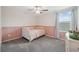 Charming bedroom featuring two-tone paint and a bed at 34797 Rainville Loop, Zephyrhills, FL 33541