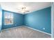 Cozy bedroom with a ceiling fan and window at 34797 Rainville Loop, Zephyrhills, FL 33541