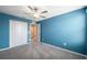 Bedroom with a ceiling fan, window, and closet at 34797 Rainville Loop, Zephyrhills, FL 33541