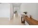 Bright entryway with wood-look floors and a modern console table at 34797 Rainville Loop, Zephyrhills, FL 33541