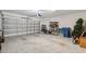 Spacious two car garage with shelving, ready for storage and vehicles at 34797 Rainville Loop, Zephyrhills, FL 33541