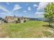 Spacious backyard with well-kept lawn, solar panels and room for outdoor activities at 3818 Beechwood Dr, Holiday, FL 34691