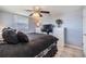 This bedroom has a neutral wall, lots of closet space, and an overhead ceiling fan at 3818 Beechwood Dr, Holiday, FL 34691