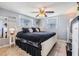 Bedroom showcasing neutral walls, two windows, a ceiling fan and a well-lit interior at 3818 Beechwood Dr, Holiday, FL 34691