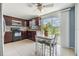 Well-lit dining area with patio access and views of the backyard at 3818 Beechwood Dr, Holiday, FL 34691