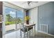 Bright dining area featuring sliding glass doors and a ceiling fan at 3818 Beechwood Dr, Holiday, FL 34691