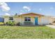 Charming single-story home featuring a well-maintained lawn and inviting front porch at 3818 Beechwood Dr, Holiday, FL 34691