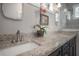 Close up of bathroom featuring granite counter with double sink vanity and decor at 409 E Frances Ave, Tampa, FL 33602