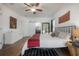 Bedroom featuring an ensuite bath, bright, well lit, and hardwood flooring at 409 E Frances Ave, Tampa, FL 33602