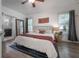 Bright bedroom with hardwood floors, ensuite bath, large mirror and decor at 409 E Frances Ave, Tampa, FL 33602