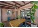 Relaxing outdoor deck area with a ceiling fan and furniture, perfect for enjoying the outdoors at 409 E Frances Ave, Tampa, FL 33602