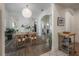 Dining area showcasing hardwood floors, archways to other rooms, and a glimpse of the kitchen at 409 E Frances Ave, Tampa, FL 33602