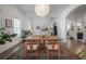 Bright and open dining area with hardwood floors and access to living spaces at 409 E Frances Ave, Tampa, FL 33602