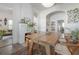 Open-concept dining room with views into living room, fireplace, and view of kitchen beyond at 409 E Frances Ave, Tampa, FL 33602