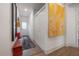 Hallway features hall tree, bench, coat closet, and art. and access to other rooms at 409 E Frances Ave, Tampa, FL 33602