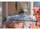 Inviting front porch with brick stairs and white columns, perfect for relaxing at 409 E Frances Ave, Tampa, FL 33602